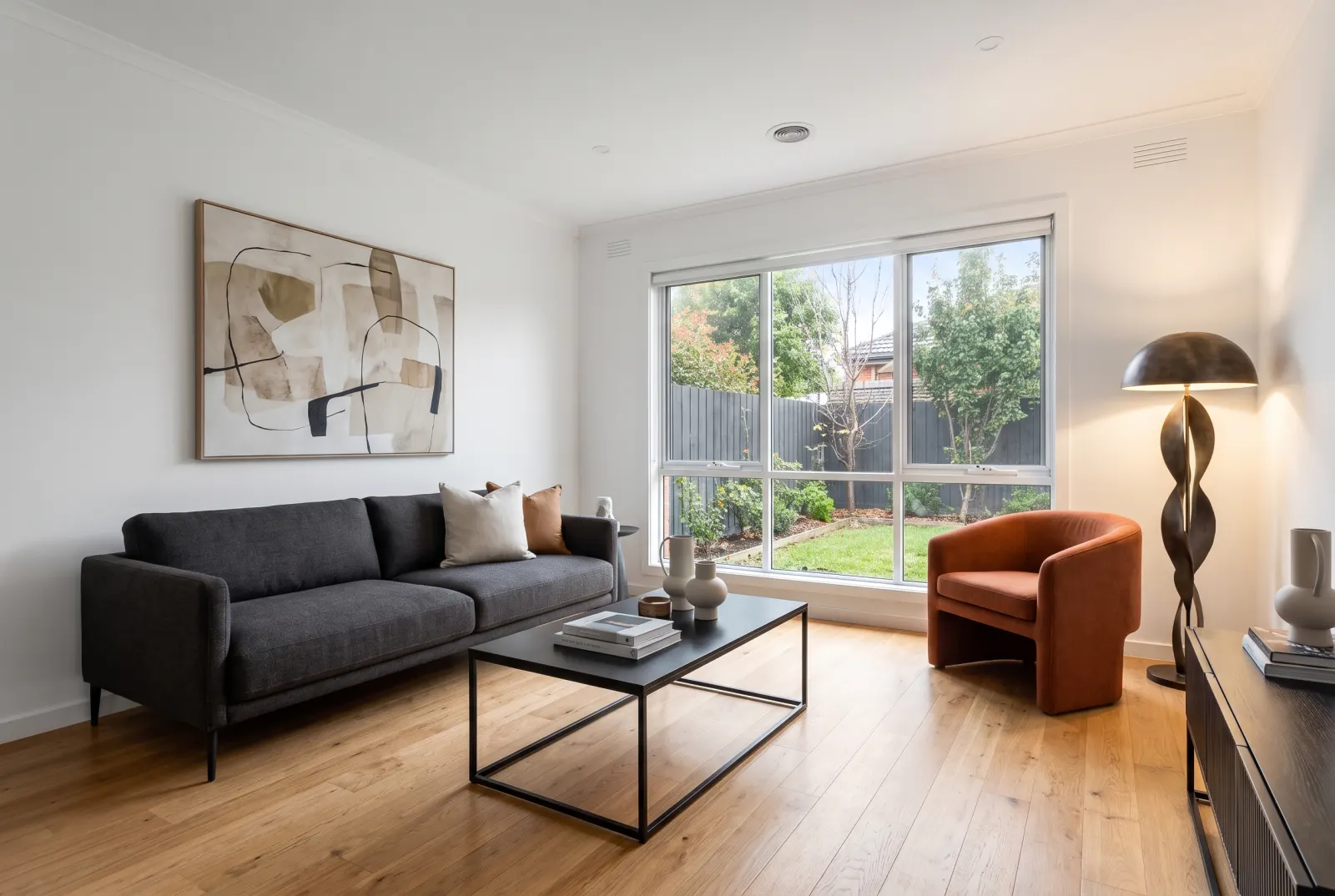Modern living room with a charcoal sofa