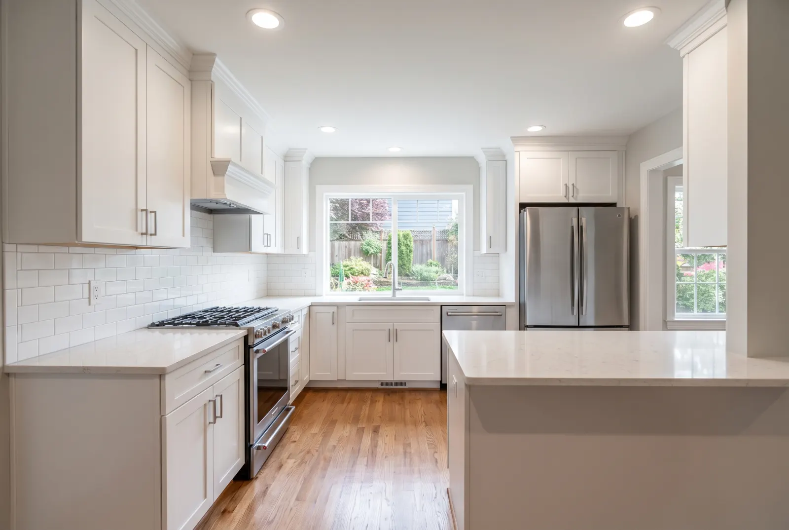 Bare white kitchen with nothing on the counters
