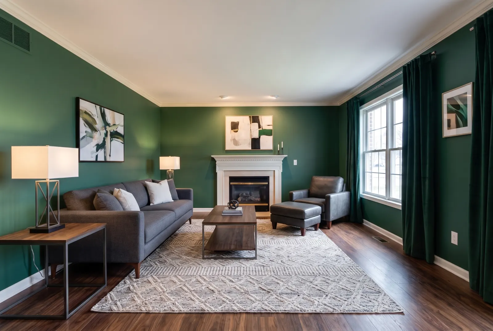 The same room with green walls, walnut floors and modern furniture