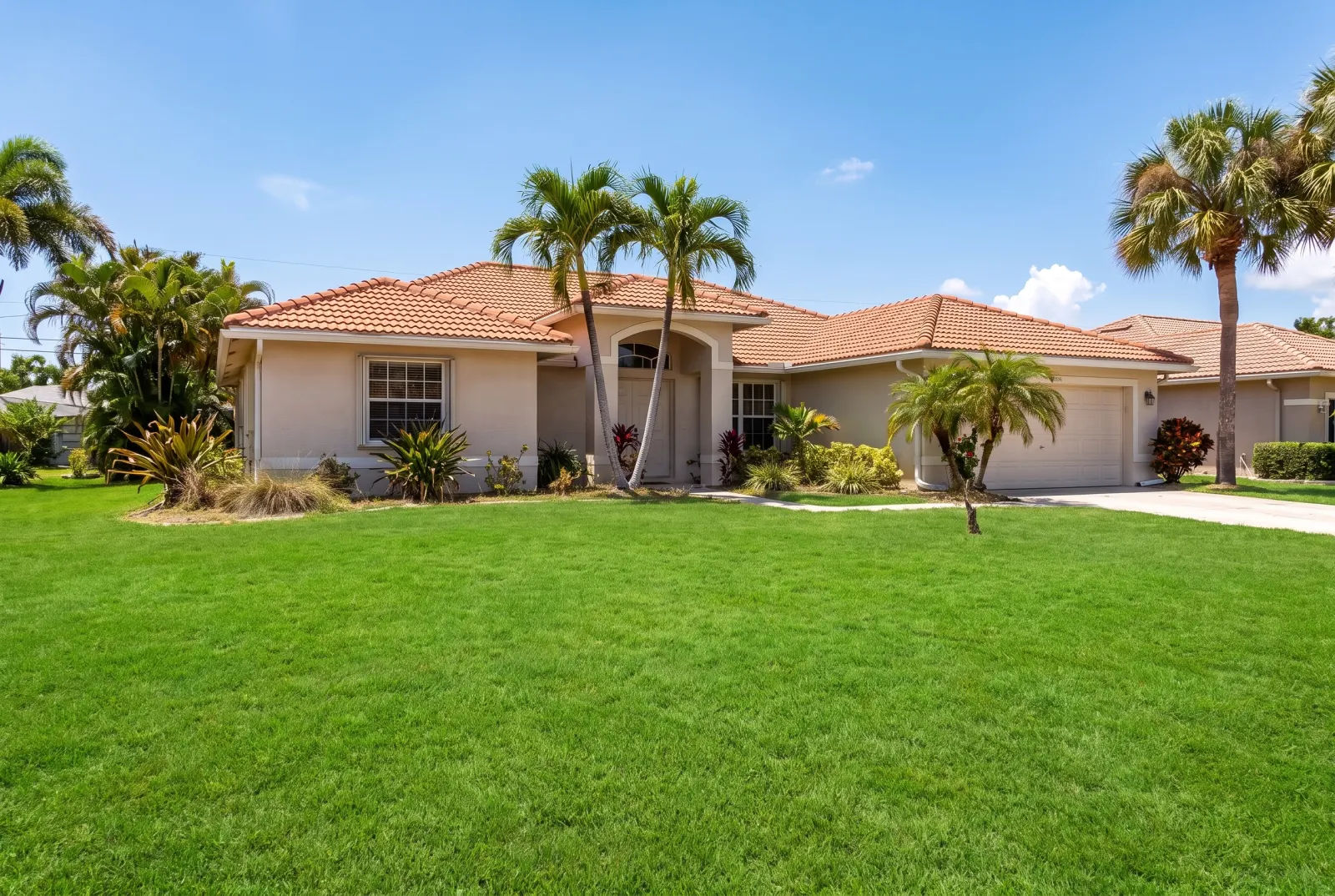 The same house with a green lawn