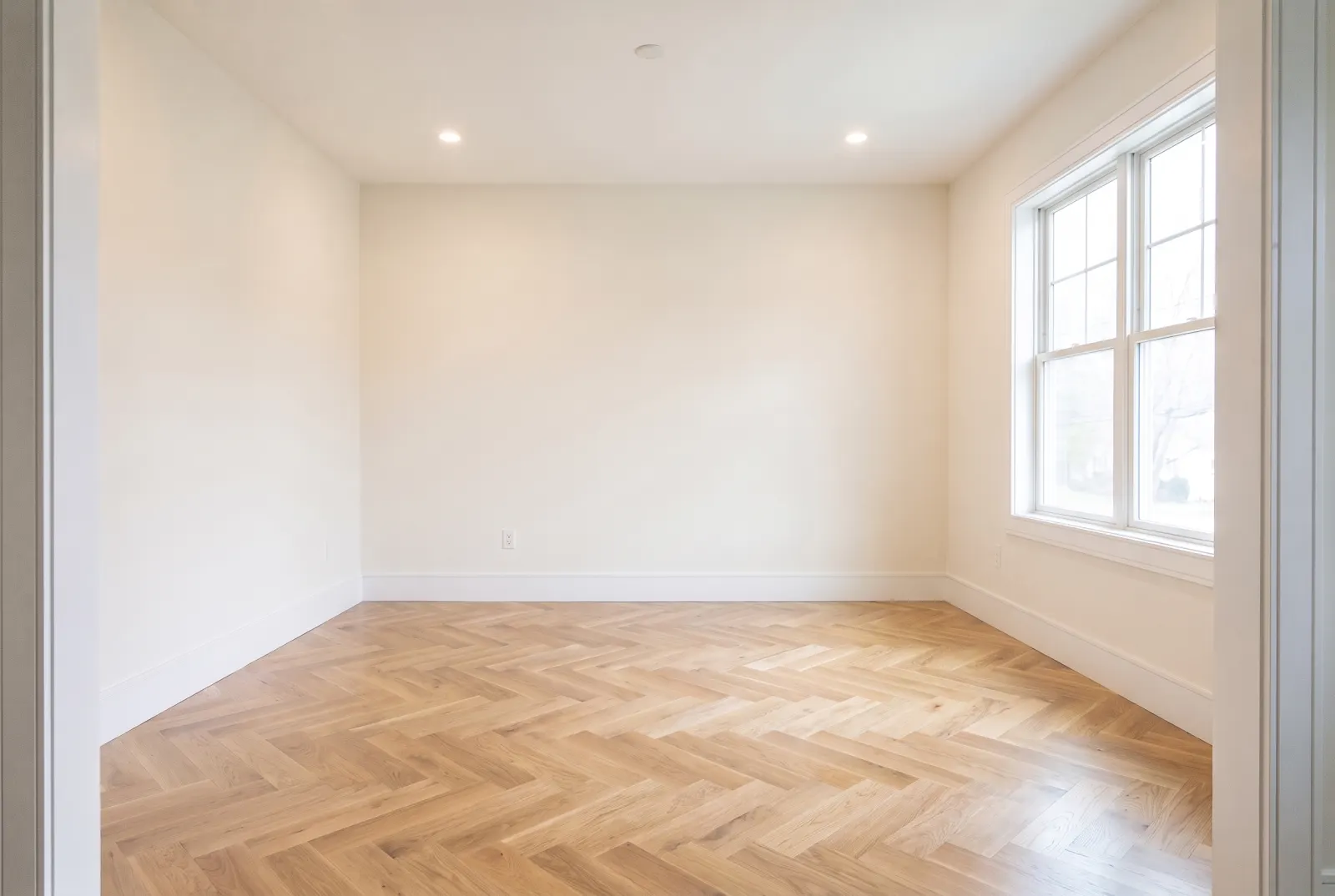 The same room with herringbone white oak flooring