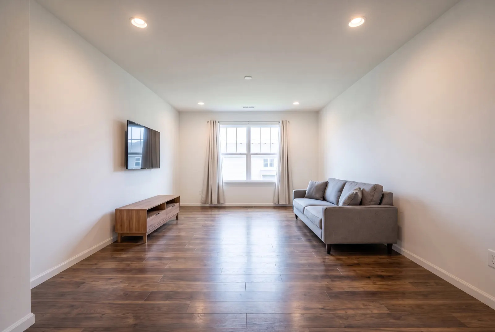 The same room with dark walnut floors