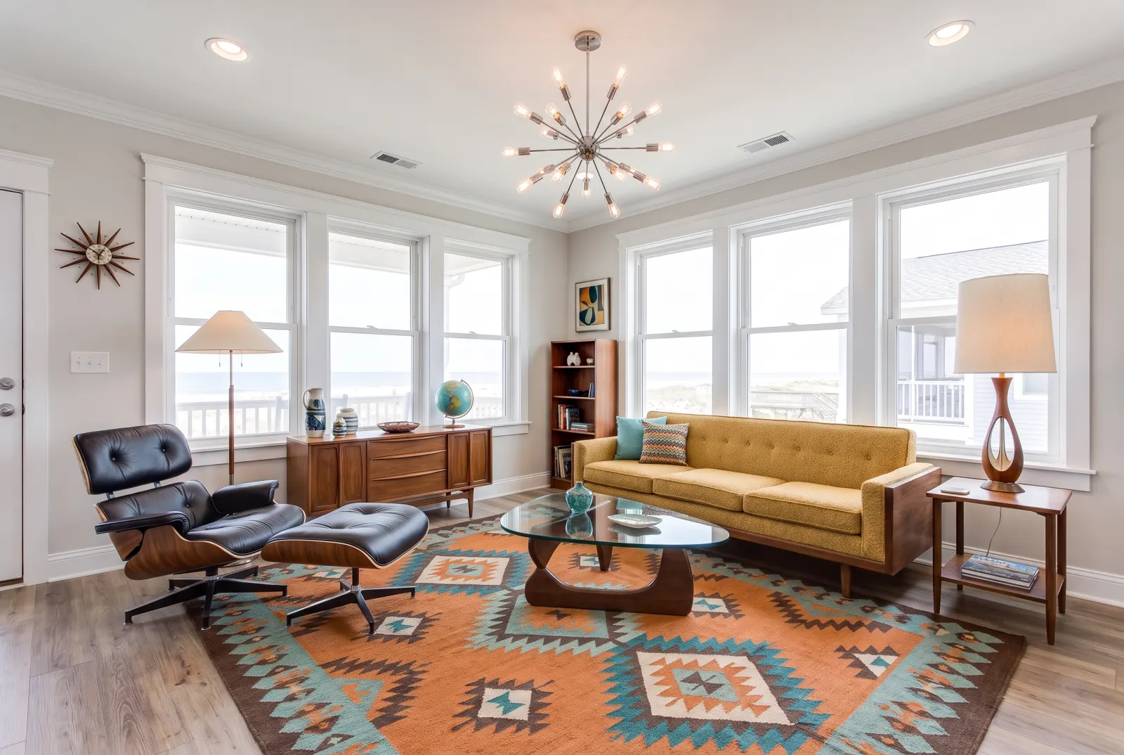 The same coastal living room restyled as mid-century modern