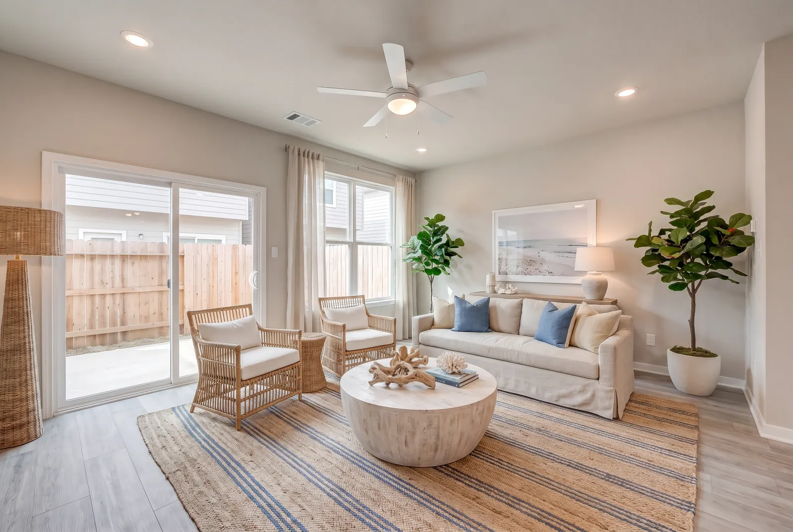 The same living room staged in coastal style
