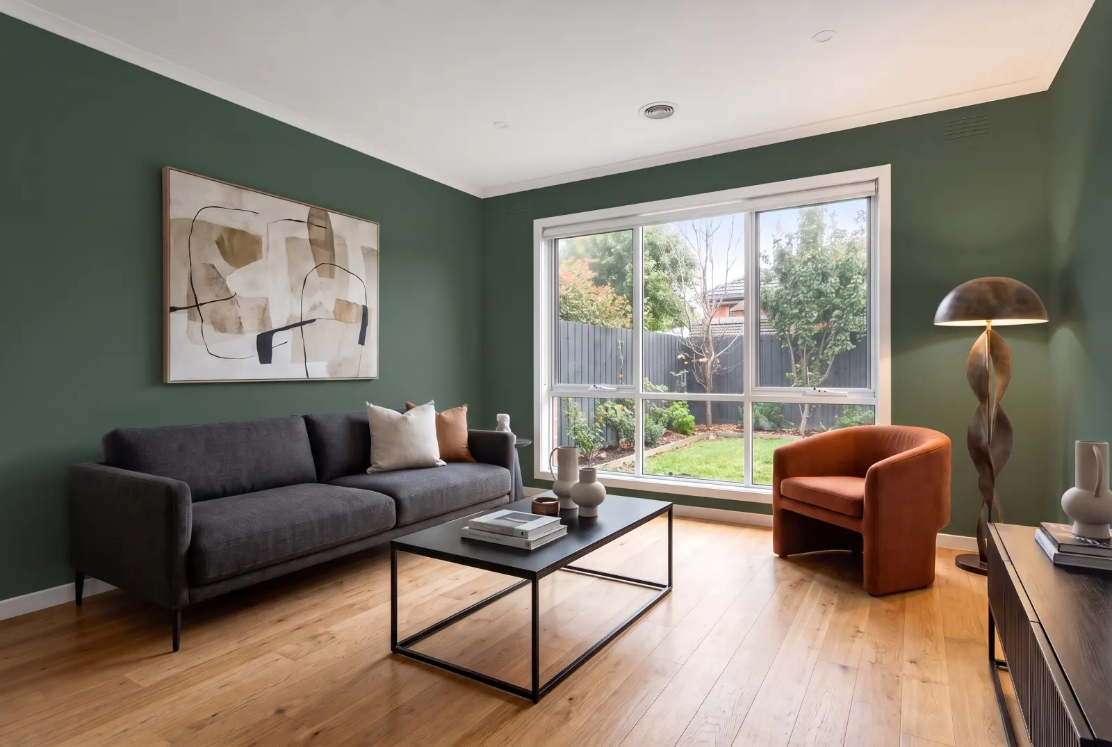 The same modern room with Moody Forest walls